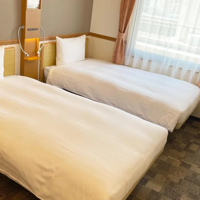 غرفة بسريرين منفصلين للمدخنين، Toyoko Inn Kagoshima Temmonkan No.2 1/5
