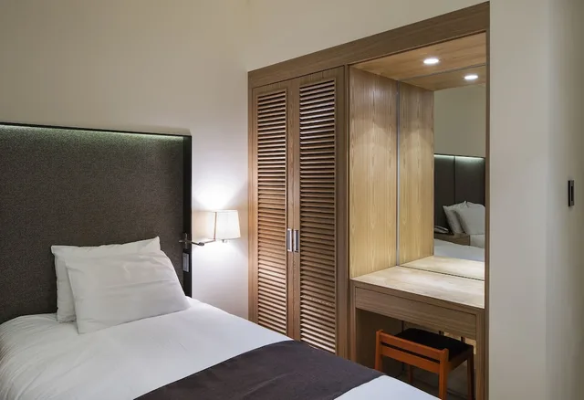 غرفة قياسية بسرير مزدوج وسرير فردي، Dukgu Oncheon Resort Hotel 2/4