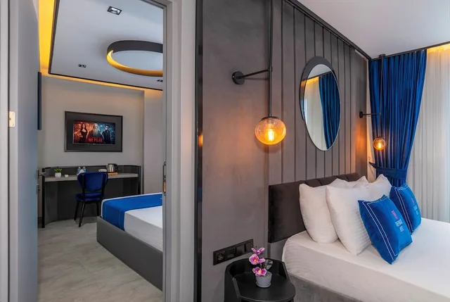 غرفة ديلوكس رباعية بسرير كوين وسريرين منفصلين، The Private Airport Hotel 6/7