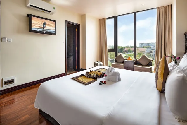 غرفة متصلة ديلوكس عائلية بسرير كينج وسريرين منفصلين، Thanh Lich Royal Boutique Hotel 5/7