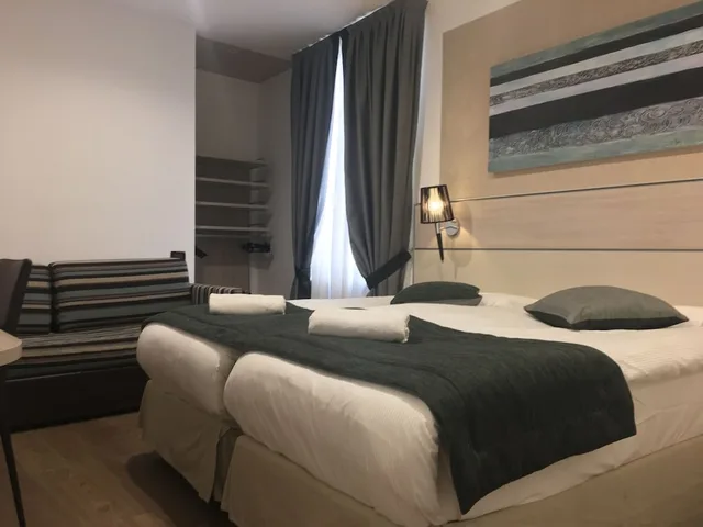 غرفة كومفورت ثلاثية بسرير مزدوج وسرير فردي، Hotel Coccodrillo 1/5