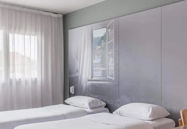 غرفة بسريرين منفصلين، B&B HOTEL Besancon Chateaufarine 1/2