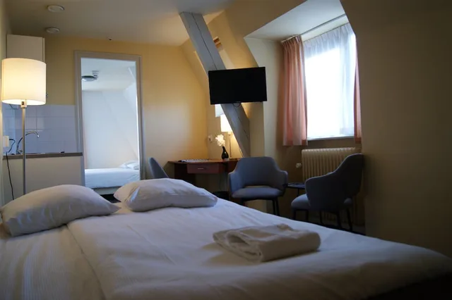 غرفة عائلية بسريرين منفصلين مع أريكة، Fletcher Hotel Gilde 1/3