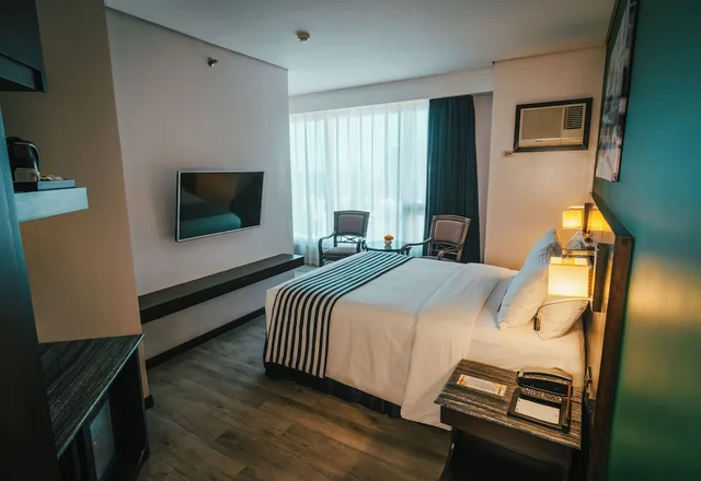 غرفة بريميوم ديلوكس بسرير كوين، 1898 Hotel Colonia En Las Filipinas 4/8