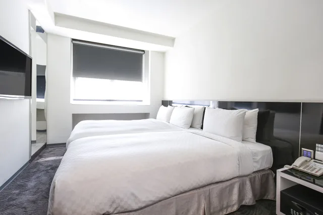 غرفة ديلوكس ثلاثية بسرير مزدوج وسرير فردي بإطلالة على المدينة بحوض استحمام، CityInn Hotel Plus Taichung Station Branch 7/10