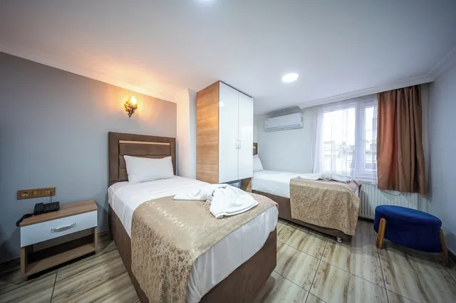 غرفة اقتصادية رباعية بسرير مزدوج وسريرين منفصلين بغرفة نوم واحدة، Laos Otel 8/10