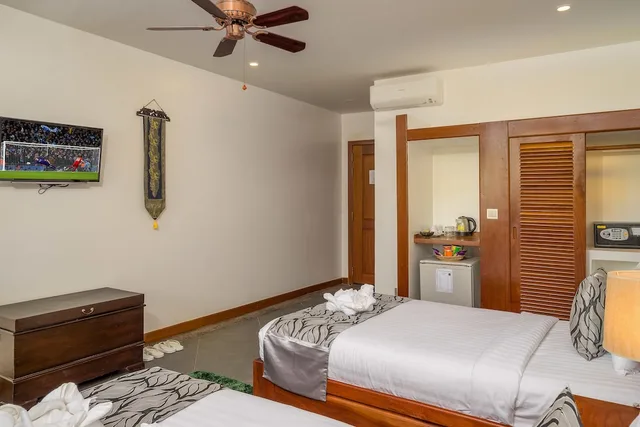غرفة ديلوكس بسريرين منفصلين بإطلالة على المسبح بشرفة، Savada Angkor Boutique Hotel 4/5