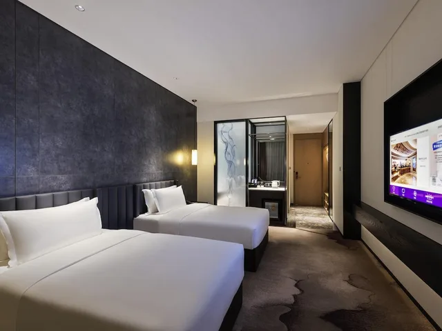 غرفة ديلوكس بسريرين منفصلين، Mercure Shenzhen Pinghu 1/4