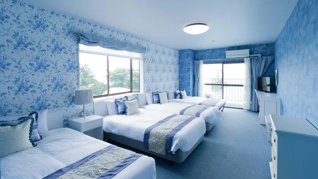 غرفة رباعية بأربعة أسرّة مع أريكة، Hotel Caretta Amami 1/1