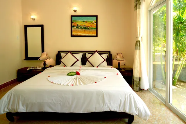 غرفة عائلية بسرير كوين وسريرين منفصلين بإطلالة على الحديقة، Le Aqua Resort & Spa Phan Thiet 2/7