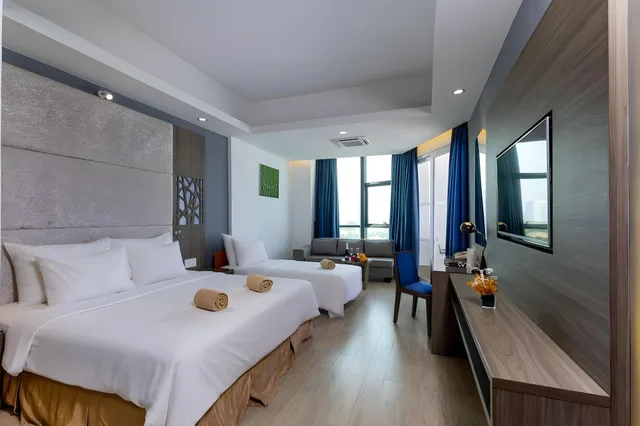 غرفة ديلوكس ثلاثية بسرير فردي بغرفة نوم واحدة، Swandor Resort Cam Ranh 1/2