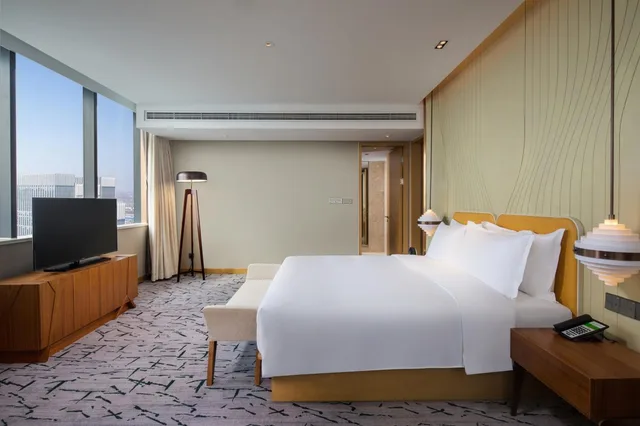 جناح بسرير كينج بغرفة نوم واحدة مع دخول الصالة، Holiday Inn Tianjin Xiqing 4/8