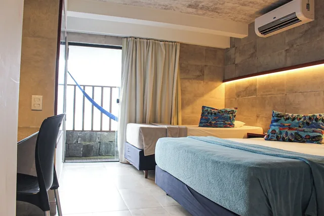 غرفة عائلية بسرير مزدوج وسرير فردي بإطلالة على البحر، Vila do Mar by GoldMen Hospitality 1/3
