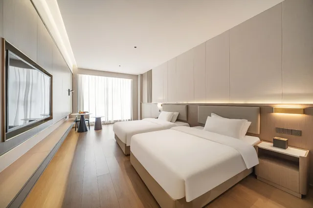 غرفة ديلوكس بسريرين منفصلين، Poltton International Service Apartment- Liuzhou Wanda Plaza 1/2