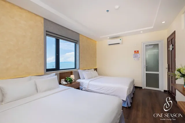 غرفة غراند رباعية بسريرين كوين بإطلالة على المدينة بغرفة نوم واحدة، Ngoc Hanh Beach Hotel 1/6