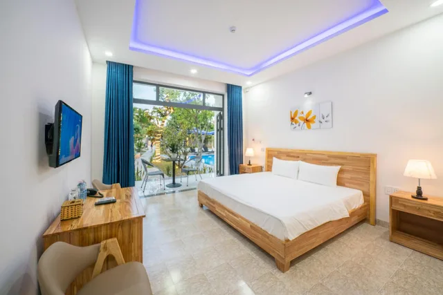 غرفة ديلوكس بسرير كوين بشرفة، Tran Family Villas Boutique Hotel 1/7