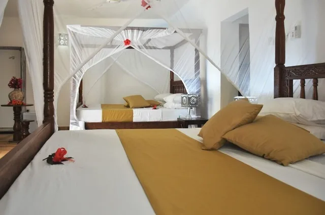 Family, 1 Single and 2 Queen Beds, Pool View, Patio، Sea View Lodge Boutique Hotel 1/4