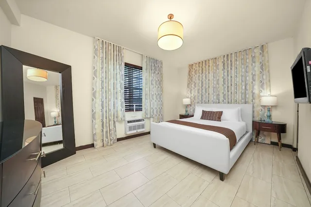 جناح بسريرين كوين بغرفتي نوم مع أريكة، Tradewinds Apartment Hotel 7/10
