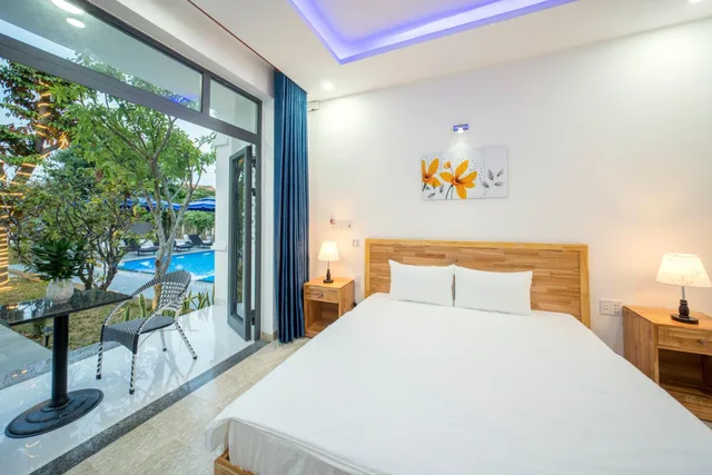 غرفة ديلوكس بسرير كوين بشرفة، Tran Family Villas Boutique Hotel 3/7