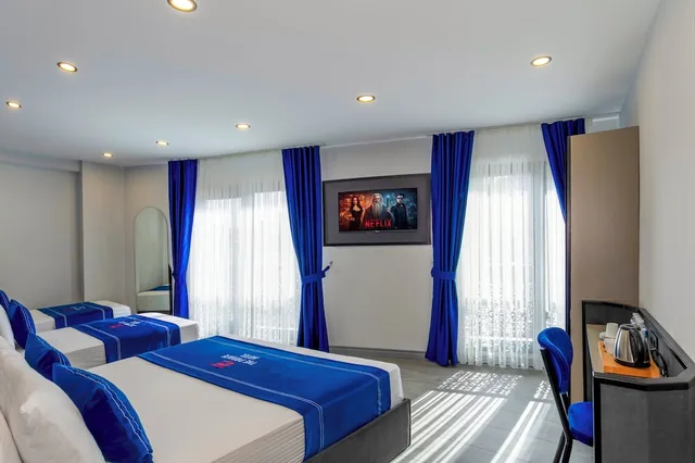 غرفة ديلوكس رباعية بسرير كوين وسريرين منفصلين، The Private Airport Hotel 3/7