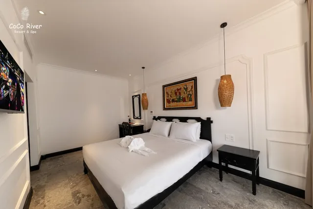 غرفة عائلية بسريرين منفصلين وسرير كينج بإطلالة على المدينة، Hoi An Coco River Resort Spa 2/10