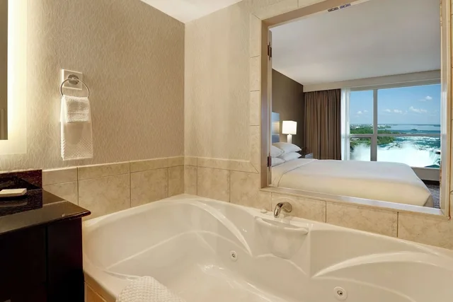 Room, King Bed, Partial Falls View, Sofa, Jetted Tub, Embassy Suites By Hilton Niagara Falls Fallsview 10/10