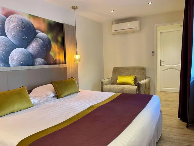 غرفة ديلوكس بسرير كينج وسرير فردي، Best Western Hotel De France 1/4