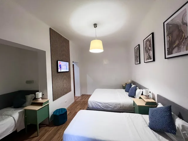 غرفة ديلوكس ثلاثية بسرير مزدوج وسرير فردي، The Place In Rome 1/10