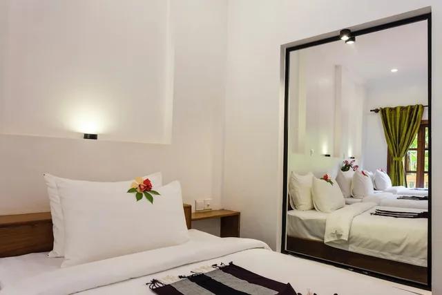 غرفة ديلوكس ثلاثية بثلاثة أسرّة بإطلالة على المسبح، Le Jardin d'Angkor Hotel 1/3