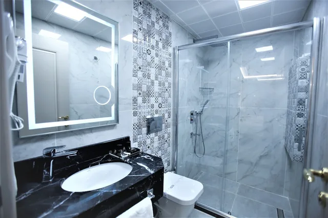 غرفة ديلوكس ثلاثية بسرير مزدوج وسرير فردي، Omma Hotel 4/4