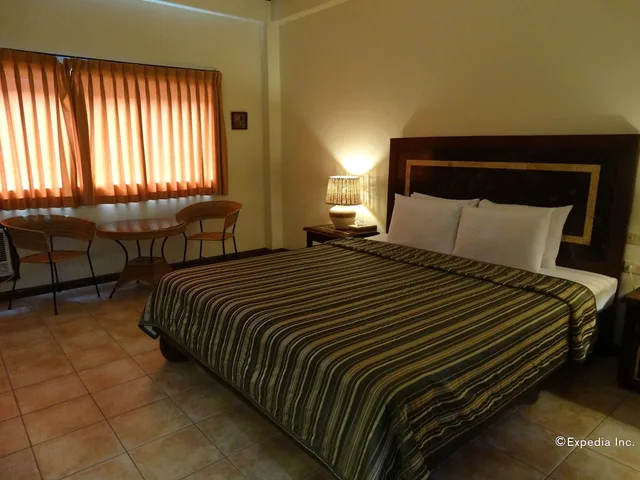 غرفة ديلوكس تنفيذية بسرير كينج، Citystate Asturias Hotel Palawan 1/10