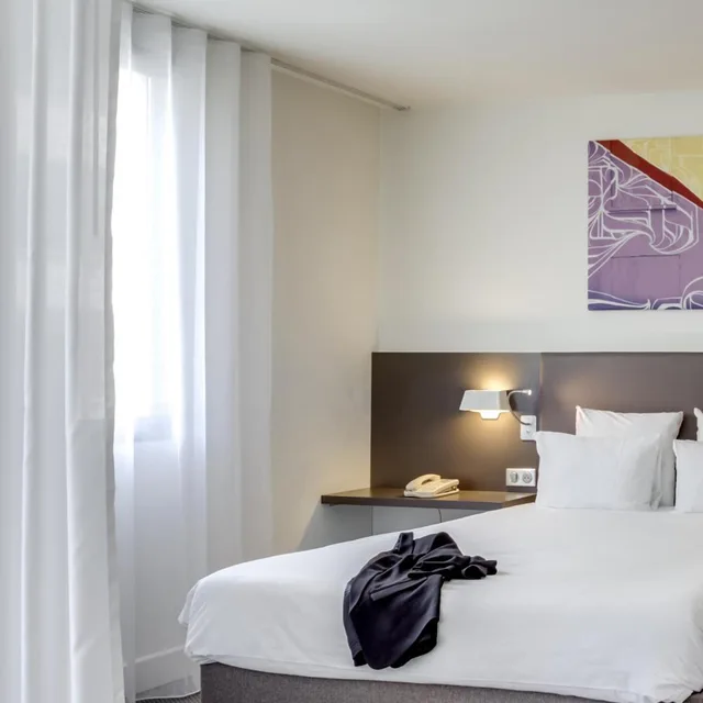 جناح سوبيريور بسرير مزدوج وسرير فردي مع أريكة، Novotel Suites Paris Stade De France 1/10