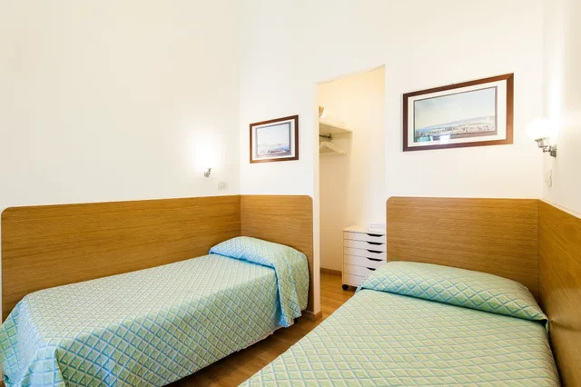 جناح عائلي بسرير كوين وسريرين منفصلين مع أريكة، Corso Italia Suites 3/10