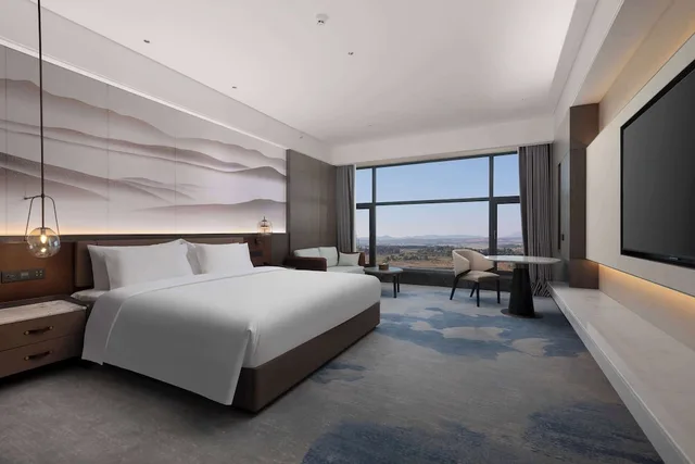 غرفة ديلوكس بسرير كينج مع أريكة بحوض استحمام، Wyndham Qujing Luliang 1/2