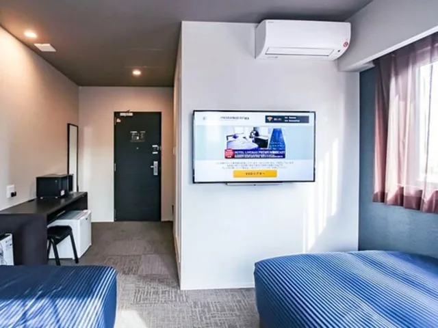 غرفة بسريرين منفصلين، Hotel Livemax Premium Osaka Umeda East 3/5