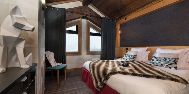 جناح دوبلكس بسرير كوين وسرير بطابقين، Hotel Village Montana 1/5