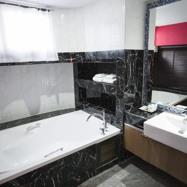غرفة ديلوكس بسريرين منفصلين، Grand Pink Hotel Hat Yai 6/6