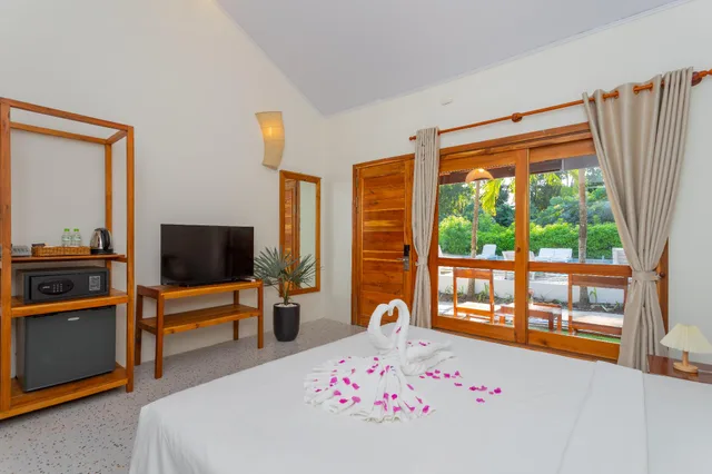 بنغل بسرير كوين بإطلالة على الحديقة، Bauhinia Resort 1/1