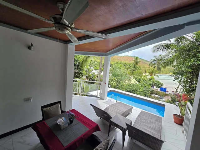 فيلا ديلوكس بسرير كوين بإطلالة على المسبح بغرفة نوم واحدة، Sea View Lodge 4/5