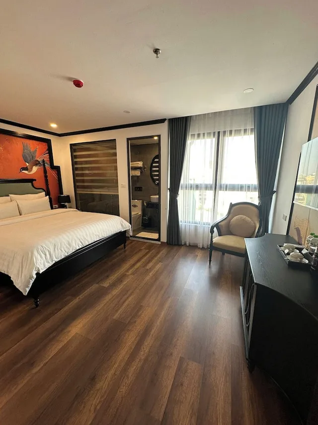 غرفة ديلوكس رباعية بسرير كينج وسريرين منفصلين، Aquarius Premium Hotel 1/7