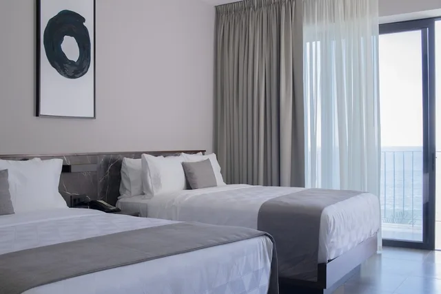 غرفة ديلوكس بسريرين مزدوجين بإطلالة على البحر، Viaggio Resort Mazatlan 2/3