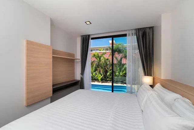 غرفة غراند عائلية بسريرين منفصلين وسريرين كينج بـ3 غرف نوم مع أريكة، Grand Kata Vip - Kata Beach 1/5