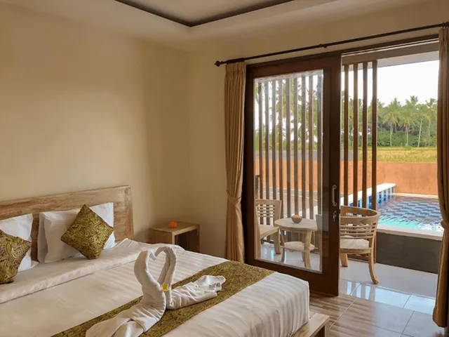 غرفة بسرير مزدوج بإطلالة على المسبح، The Sawah Resort and Villa 1/3