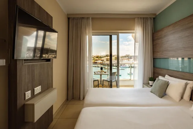 غرفة ديلوكس بإطلالة على المدينة بغرفة نوم واحدة، 115 The Strand Hotel And Suites 1/1