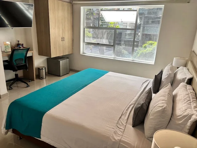 غرفة ديلوكس بسرير كينج بحوض جاكوزي، Hotel Boutique Laureles 7/10