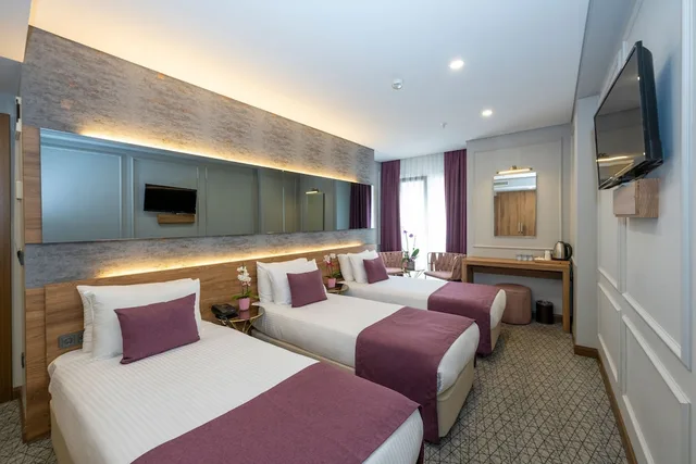 غرفة كومفورت ثلاثية بسرير كينج وسرير فردي، Graziella Gold Hotel 2/3