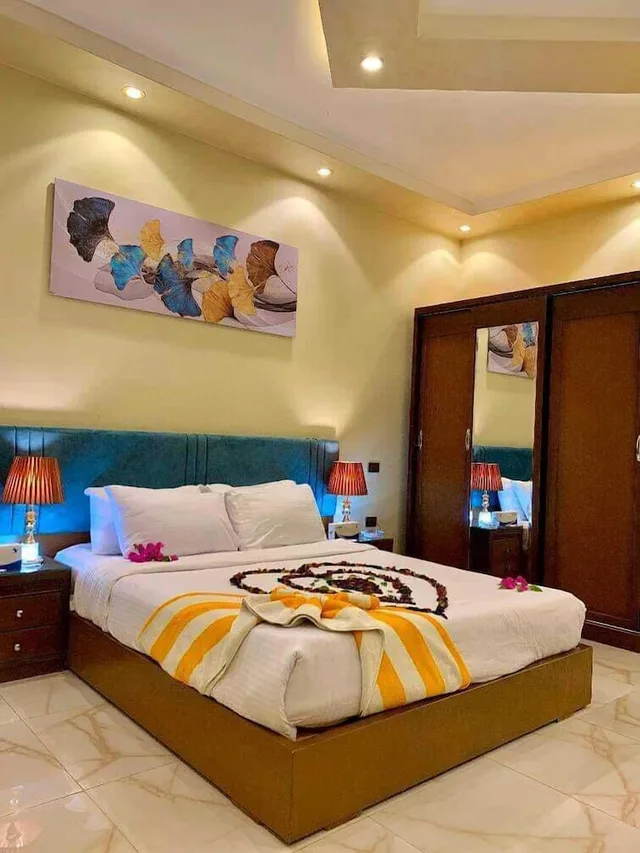 غرفة بسرير كينج وسرير كوين بإطلالة على الحديقة، Ramage Hotel & Resort 1/6