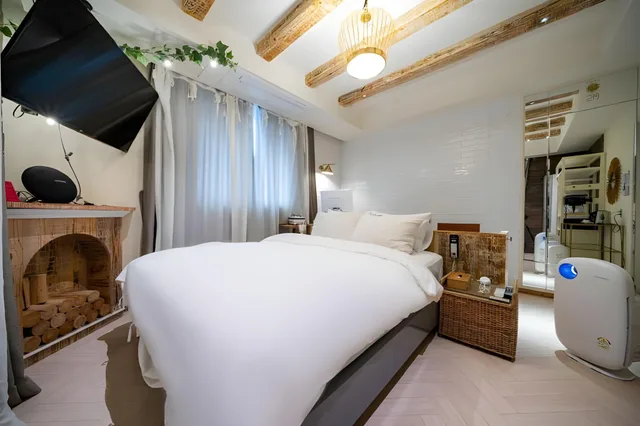 جناح بسريرين مزدوجين بإطلالة جزئية على البحر، SongJeong Lesign Hotel 1/2