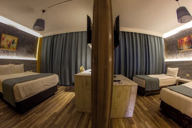 غرفة ديلوكس رباعية بغرفتي نوم، Baykara Hotel 1/2