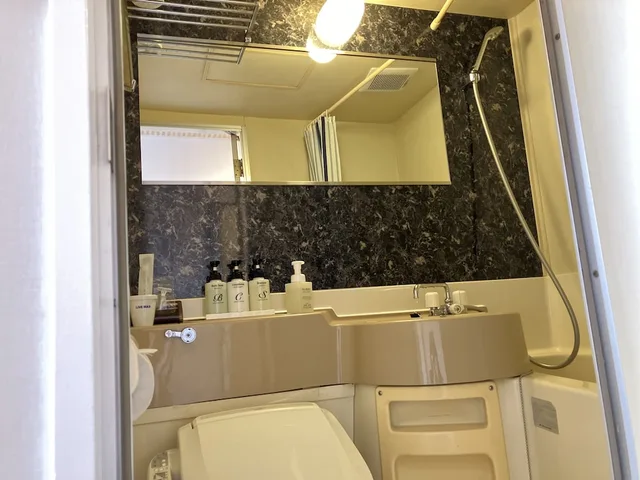 غرفة تقليدية بفراش فوتون وسرير فردي، Hotel Livemax Budget Shinosaka 1/1